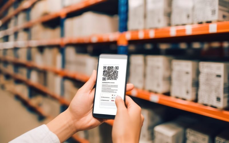 hand-holding-smartphone-warehouse